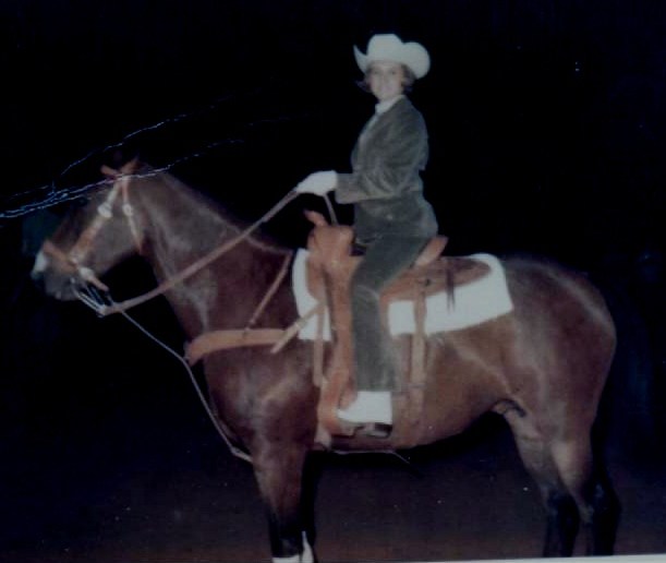 PHOTO OF MARSHA RIDING IN PARADE